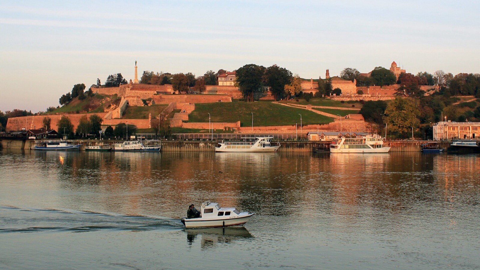 Fortress walls above the meeting of two rivers, evening light