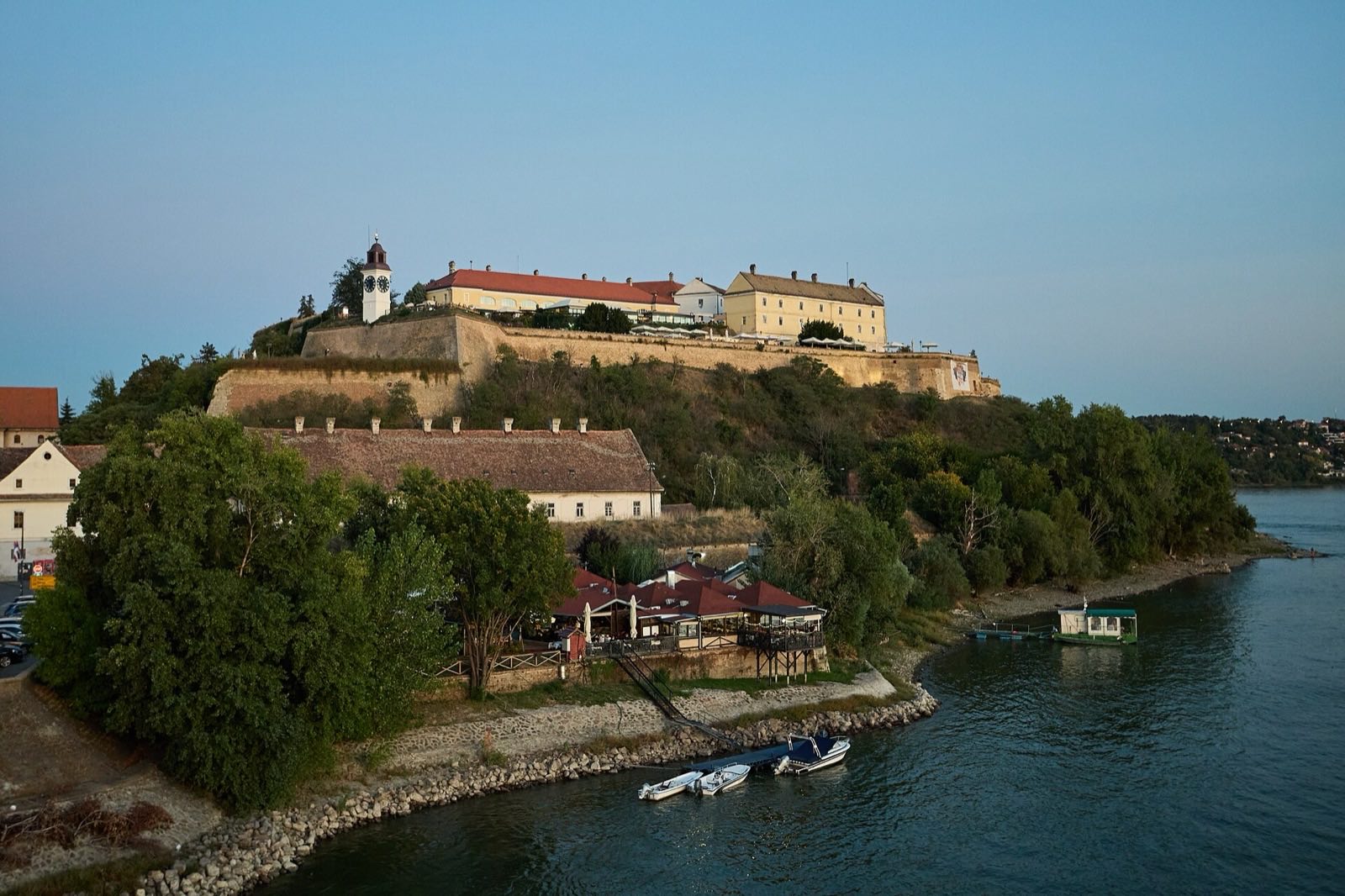 Fortress clock tower with the Danube and city below