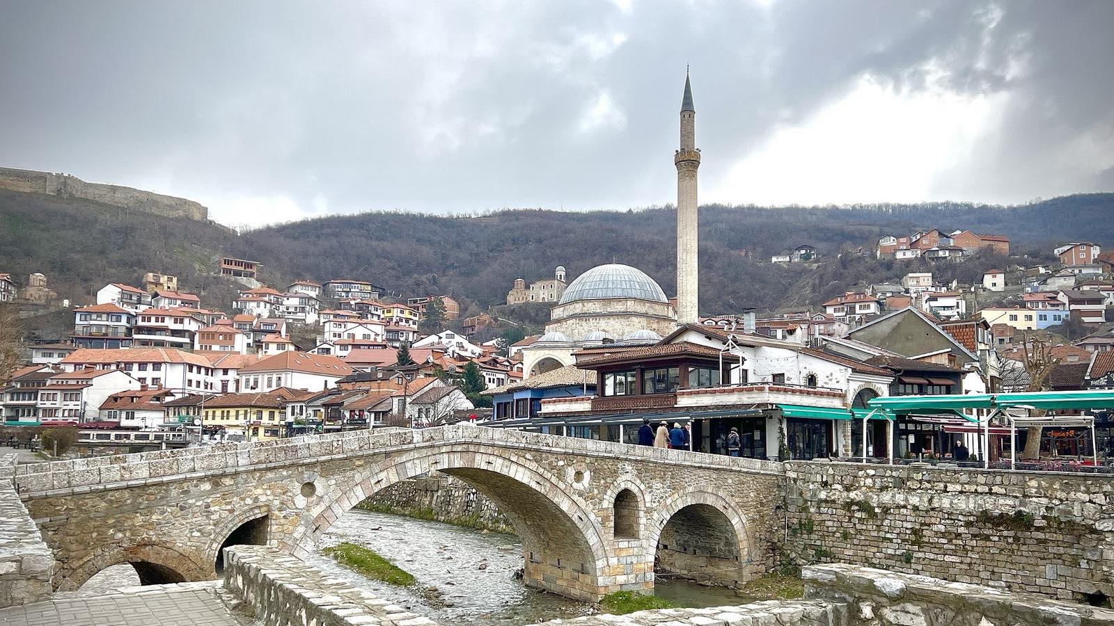 Ottoman old town along the river, fortress hill behind