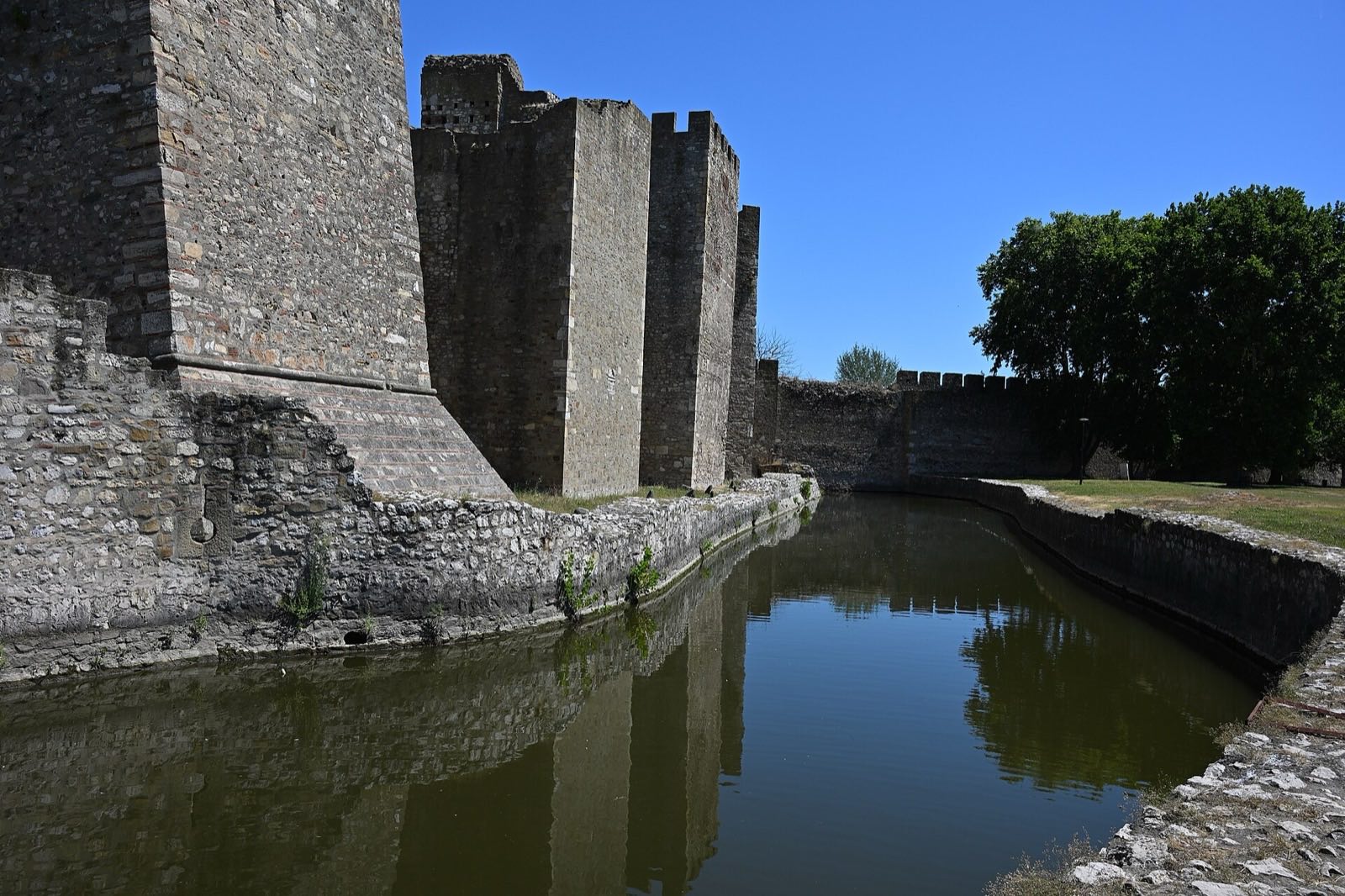 Long crenellated walls and towers on the Danube bank