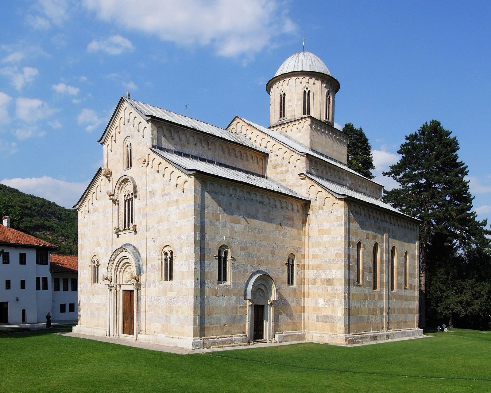 Marble monastery church among chestnut trees